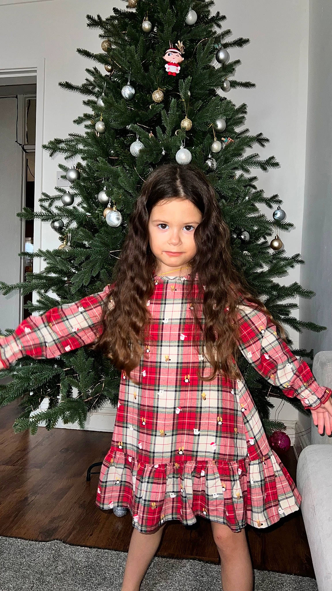 Daria joined the competition — help win amazing prizes! christmas_decoration, christmas_ornament, christmas_tree, face, fashion, fashion_design, hair, hairstyle, human_body, outerwear, pattern, person, plaid, red, sleeve, standing, tartan, textile, toy, waist