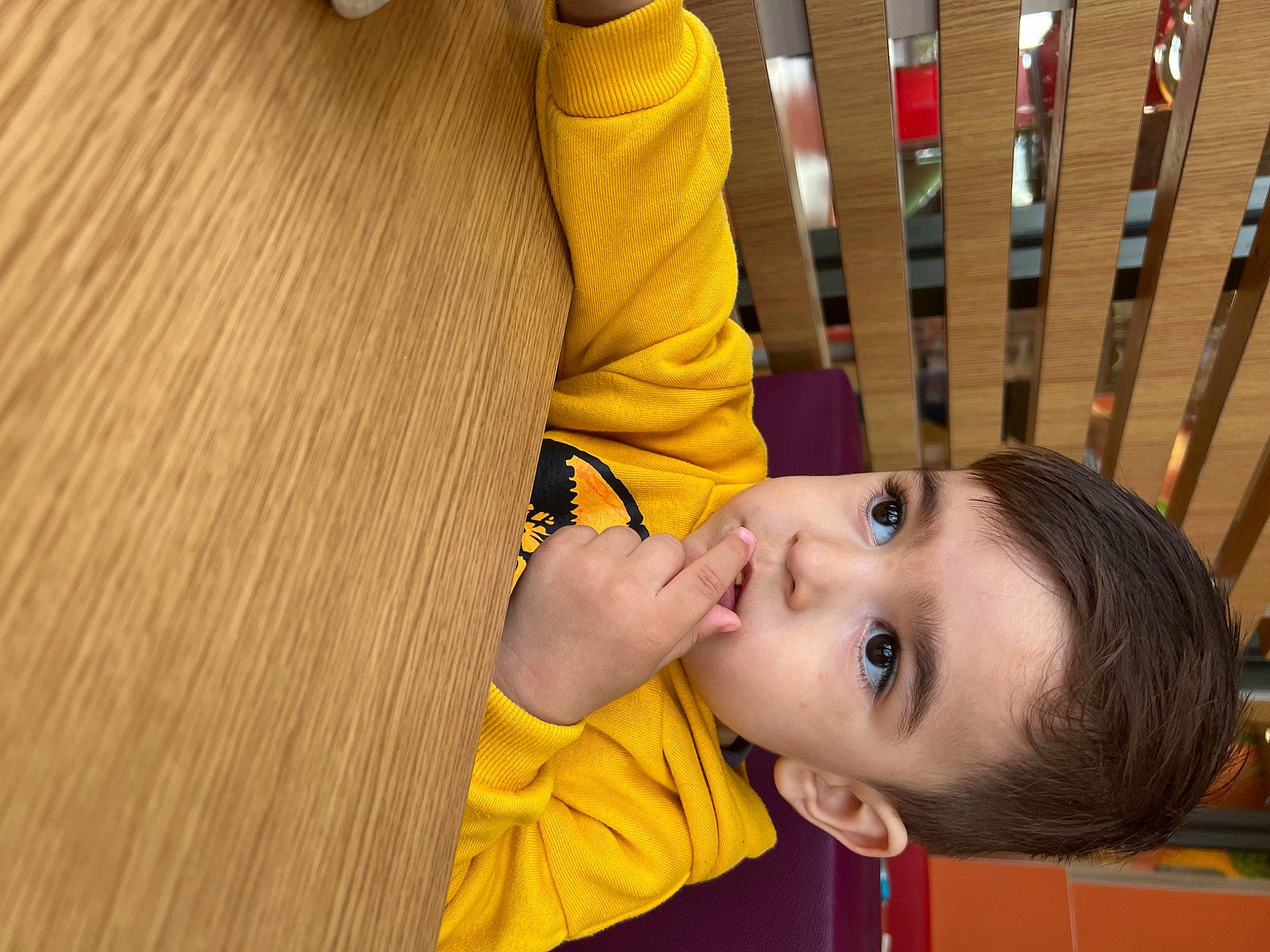 Steven is registered to the contest to win money with this photo: chair, cheek, child, chin, flooring, fun, happy, hardwood, leisure, nose, person, recreation, room, smile, t_shirt, toddler, wood