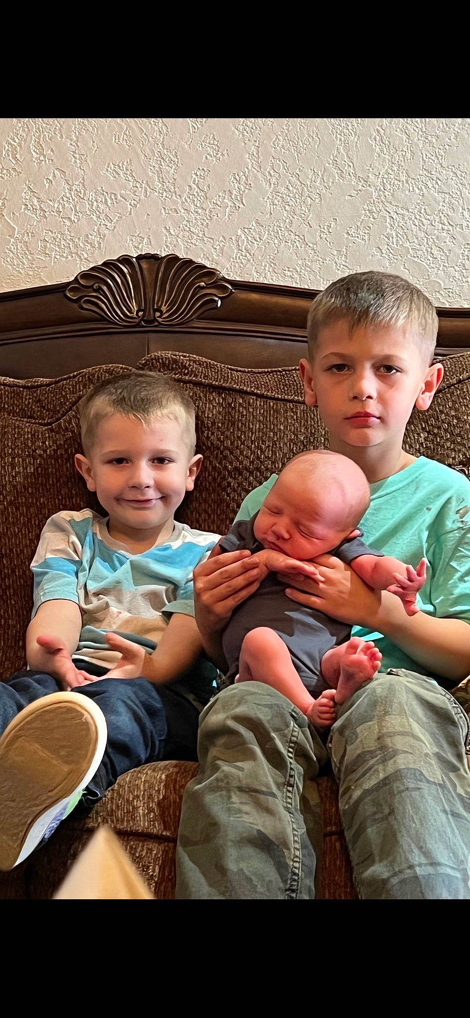 Jeremy is registered to the contest to win money with this photo: arm, baby_toddler_clothing, cheek, comfort, finger, fun, happy, head, joy, lap, leg, leisure, people, person, photograph, skin, smile, standing, summer, t_shirt