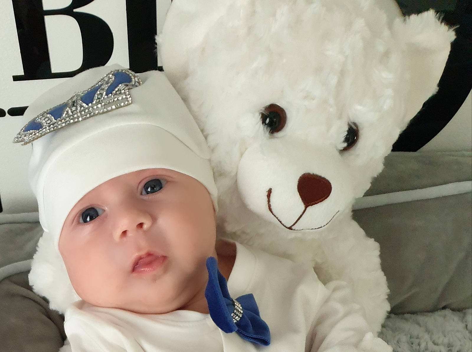 David joined the competition — help win amazing prizes! baby, baby_toddler_clothing, cap, cheek, child, eye, eyelash, facial_expression, font, happy, head, headgear, headwear, nose, person, smile, stuffed_toy, teddy_bear, textile, toddler