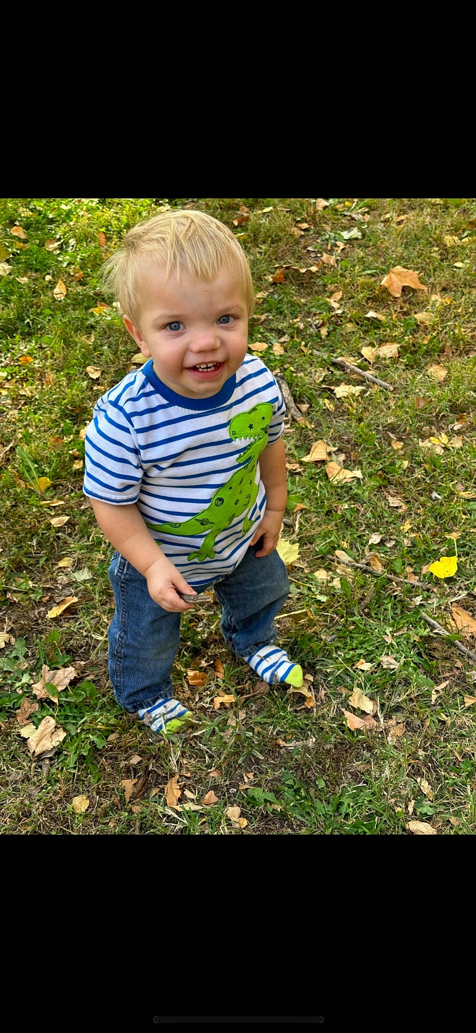 Denver joined the competition — help win amazing prizes! baby, baby_toddler_clothing, child, clothing, fun, gesture, grass, groundcover, happy, joy, pattern, people_in_nature, person, plant, play, sitting, sleeve, smile, soil, t_shirt