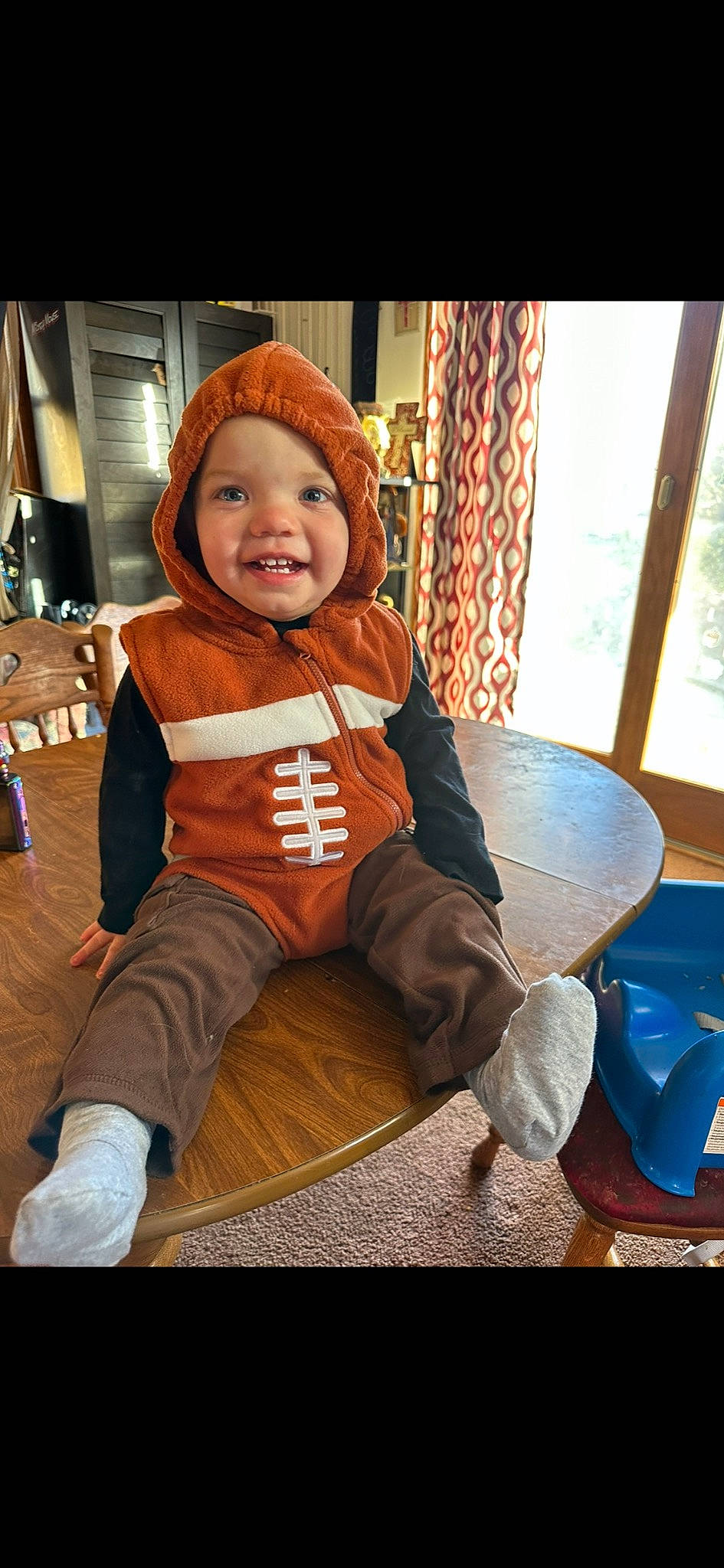 Denver joined the competition — help win amazing prizes! baby, baby_toddler_clothing, cap, chair, child, comfort, curtain, flooring, fun, fur, happy, headwear, human_leg, joy, leisure, person, personal_protective_equipment, room, sitting, smile