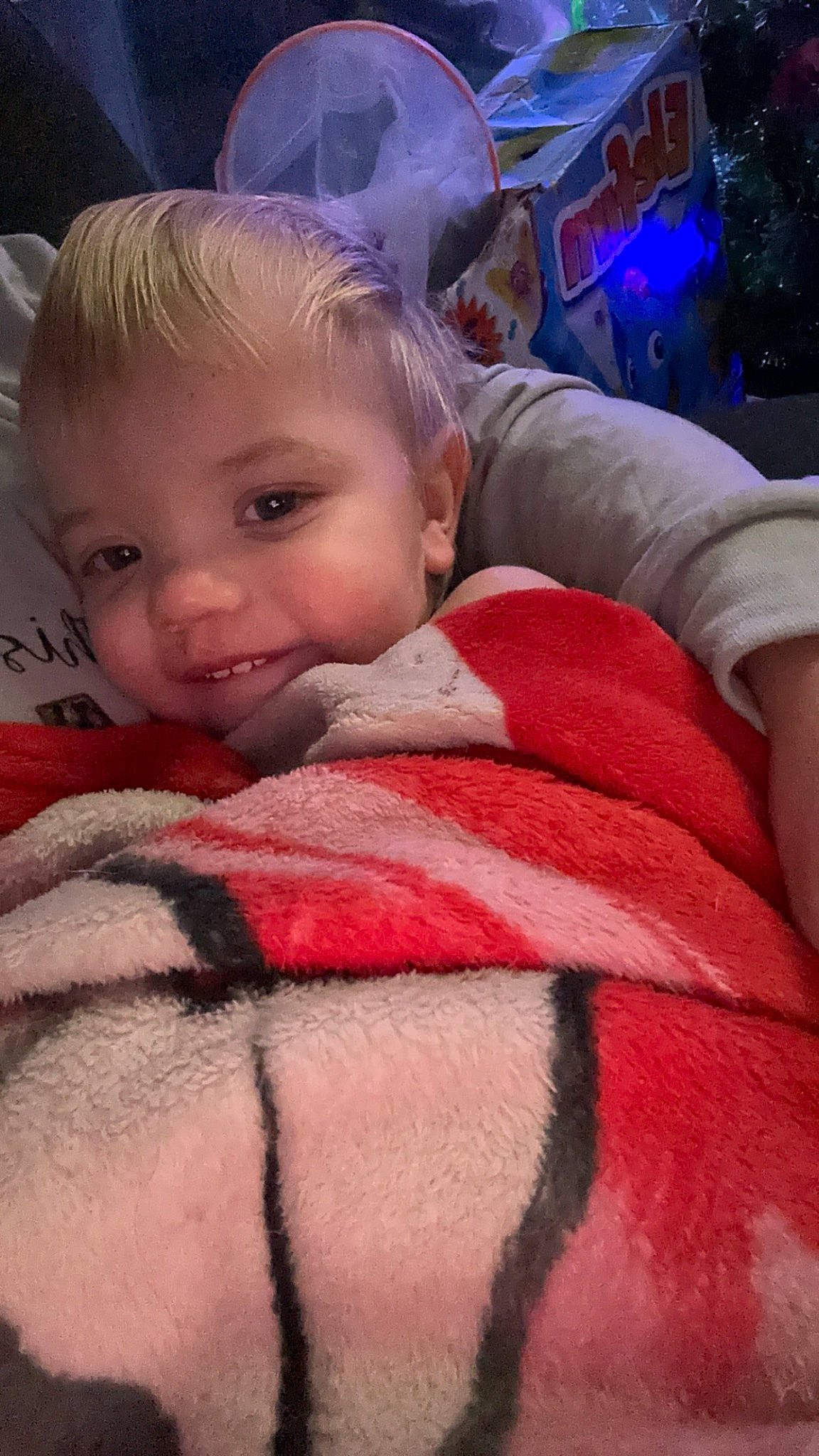 Denver is registered to the contest to win money with this photo: baby, cheek, chin, comfort, cool, eye, eyebrow, finger, fun, head, iris, linens, lip, mouth, nose, person, pink, skin, smile, textile