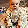 Sawyer joined the competition — help win amazing prizes! baby, child, infant, knit_sweater, bow, socks, quilt, patterned_bedding, curious_expression, indoors, cute, crawling, hands, feet, face, headwear, warm_clothing, soft_lighting, portrait, playpen