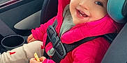 Sawyer is registered to the contest to win money with this photo: toddler, child, car_seat, pink_jacket, smiling, snack, car_interior, seatbelt, window, hair, cute, happy, clothing, sitting, young_child, baby, face, person, warm_clothes, cozy