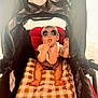 baby, child, stroller, sunglasses, blanket, bib, cute, playful, tongue, infant, seated, canopy, red, brown, checkered, clothing, foot, hand, indoor, portrait