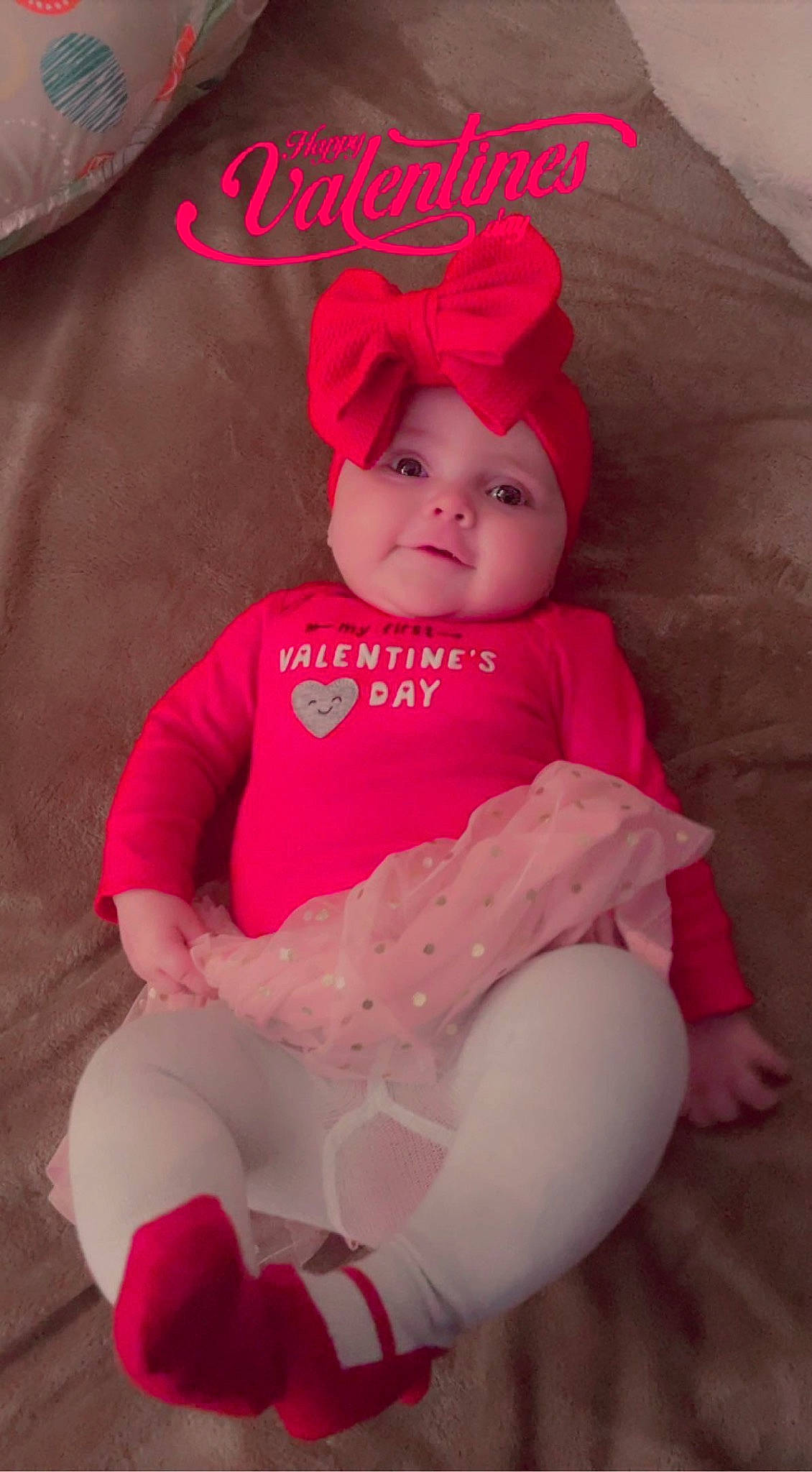 Emberlee is registered to the contest to win money with this photo: baby, baby_toddler_clothing, beauty, cap, child, costume_hat, fashion_accessory, font, happy, hat, headgear, headwear, magenta, peach, person, pink, sitting, skin, sleeve, smile