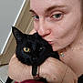 Abysse a rejoint le concours — aidez-le/la à gagner de superbes lots ! person, black_cat, green_eyes, pet, affectionate, kiss, close_up, indoor, portrait, whiskers, fur, hand, arm, wristwatch, necklace, door, floor_tile, cute, snuggle, selfie