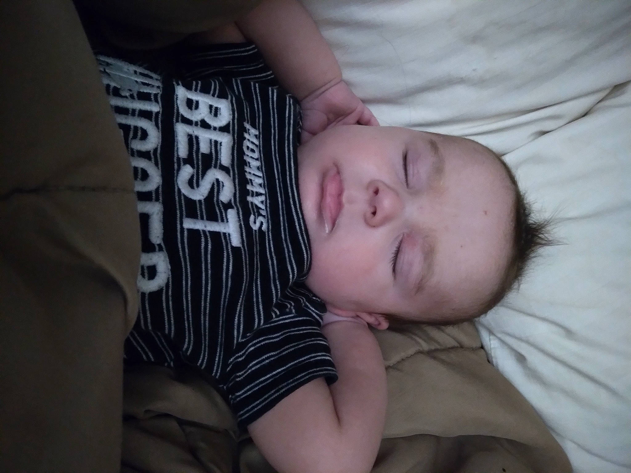 Collin is registered to the contest to win money with this photo: baby, baby_toddler_clothing, cheek, child, chin, comfort, elbow, eyelash, flash_photography, grey, mouth, nose, pattern, person, portrait_photography, sitting, skin, sleeve, t_shirt, toddler