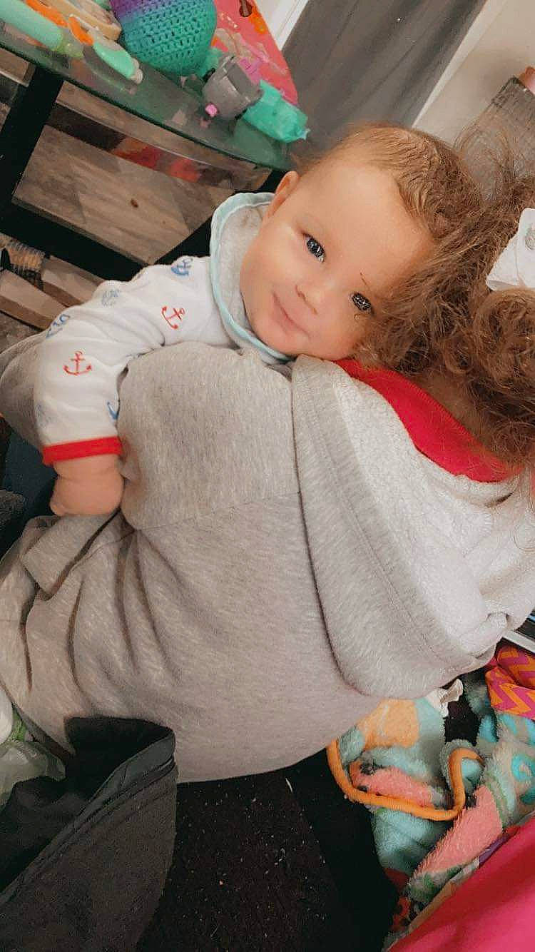 Collin is registered to the contest to win money with this photo: baby, baby_products, baby_toddler_clothing, cheek, child, comfort, eye, face, finger, fun, happy, head, iris, lap, person, room, sitting, skin, smile, toddler