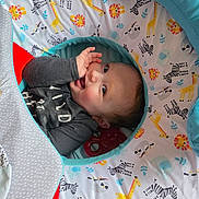 Tommy joined the competition — help win amazing prizes! baby, child, infant, playmat, animal_print, giraffe, lion, zebra, sloth, colorful, soft, cute, hand, face, sleeve, clothing, indoors, portrait, smiling, playtime