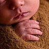 Bakari joined the competition — help win amazing prizes! baby, blanket, brown, close_up, cozy, cute, face, fingers, hand, infant, newborn, peaceful, portrait, resting, skin, sleeping, soft, tender, warm, wrapped