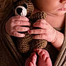 baby, brown, closeup, cozy, crocheted_toy, cute, fabric, feet, fingers, hands, infant, newborn, peaceful, portrait, skin, sleeping, soft_lighting, teddy_bear, toes, wrapped