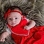 Elaina is registered to the contest to win money with this photo: baby, infant, red_dress, headband, fluffy_rug, lying_down, cute, small_hands, blue_eyes, curious_expression, soft_texture, indoors, portrait, child, adorable, clothing, closeup, person, young, face