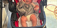 Stetson joined the competition — help win amazing prizes! baby, stroller, toy, elephant, plush, red, blanket, smiling, child, infant, face, person, indoor, floor, wheel, clothing, hand, foot, garage, equipment