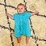 Stetson joined the competition — help win amazing prizes! baby, infant, blue_romper, lying_down, fluffy_rug, patterned_rug, wooden_marker, two_months, cute, smiling, child, indoors, soft_texture, comfortable, happy, skin, face, arms, legs, foot
