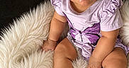 Kalani joined the competition — help win amazing prizes! baby, butterfly_print, child, closeup, cute, dark_background, fluffy_blanket, frills, happy, headband, indoors, infant, personalized, portrait, purple_clothing, script_text, sitting, smiling, soft_texture, white_socks