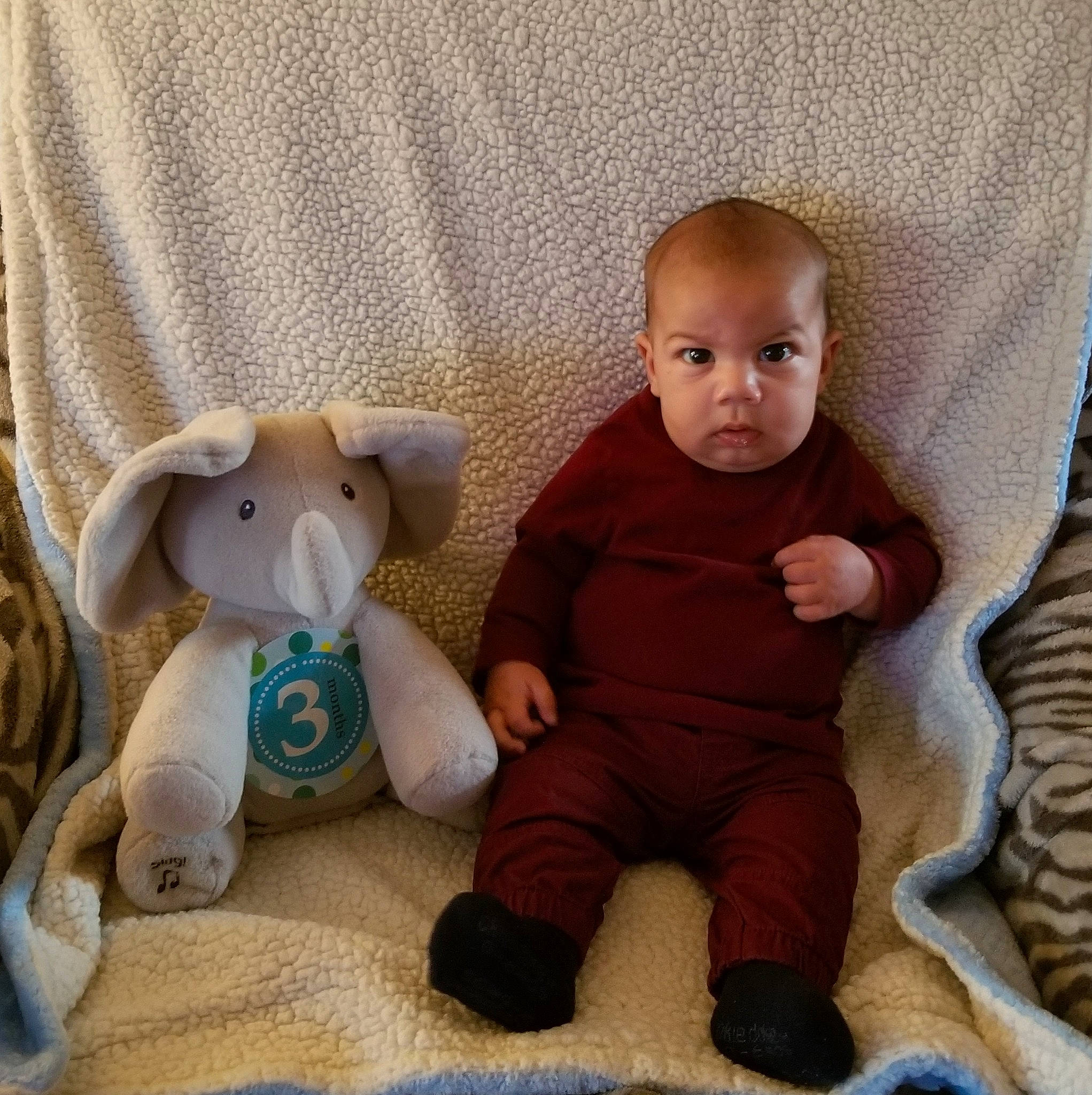 Rayshaun Jr is registered to the contest to win money with this photo: baby, baby_toys, child, ear, fawn, head, knitting, person, product, sibling, sitting, skin, smile, stuffed_toy, toddler, toy, wool