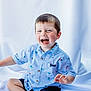 Jetsen is registered to the contest to win money with this photo: child, toddler, boy, smiling, laughing, shirt, striped_shirt, sailboat_pattern, shorts, sitting, white_background, happy, cute, portrait, indoor, childrens_fashion, young_child, face, hands, short_hair