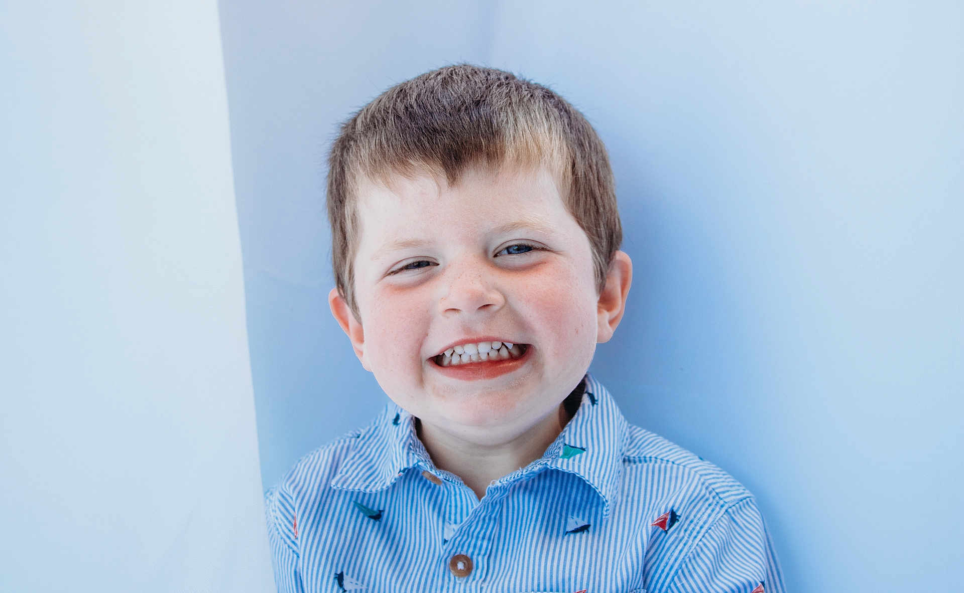 Jetsen joined the competition — help win amazing prizes! child, boy, smiling, happy, face, portrait, casual_clothing, blue_shirt, short_hair, freckles, indoor, background, cute, young, person, teeth, head_and_shoulders, expression, joyful, light