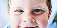 Jetsen is registered to the contest to win money with this photo: child, face, blue_eyes, freckles, smile, close_up, portrait, young_child, skin, hair, happy, person, innocence, cute, expression, childhood, outdoor, natural_light, head, eyebrows