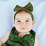 baby, infant, child, blue_eyes, headband, green_clothing, drool, smile, closeup, portrait, cute, soft_background, sleeveless, buttoned_shirt, skin, face, expression, young, adorable, lying_down