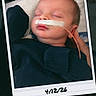 James is registered to the contest to win money with this photo: baby, child, closed_eyes, clothing, cute, face, handwritten_date, head, hospital, indoor, infant, medical_tape, nasal_tube, newborn, person, polaroid, portrait, resting, skin, sleeping