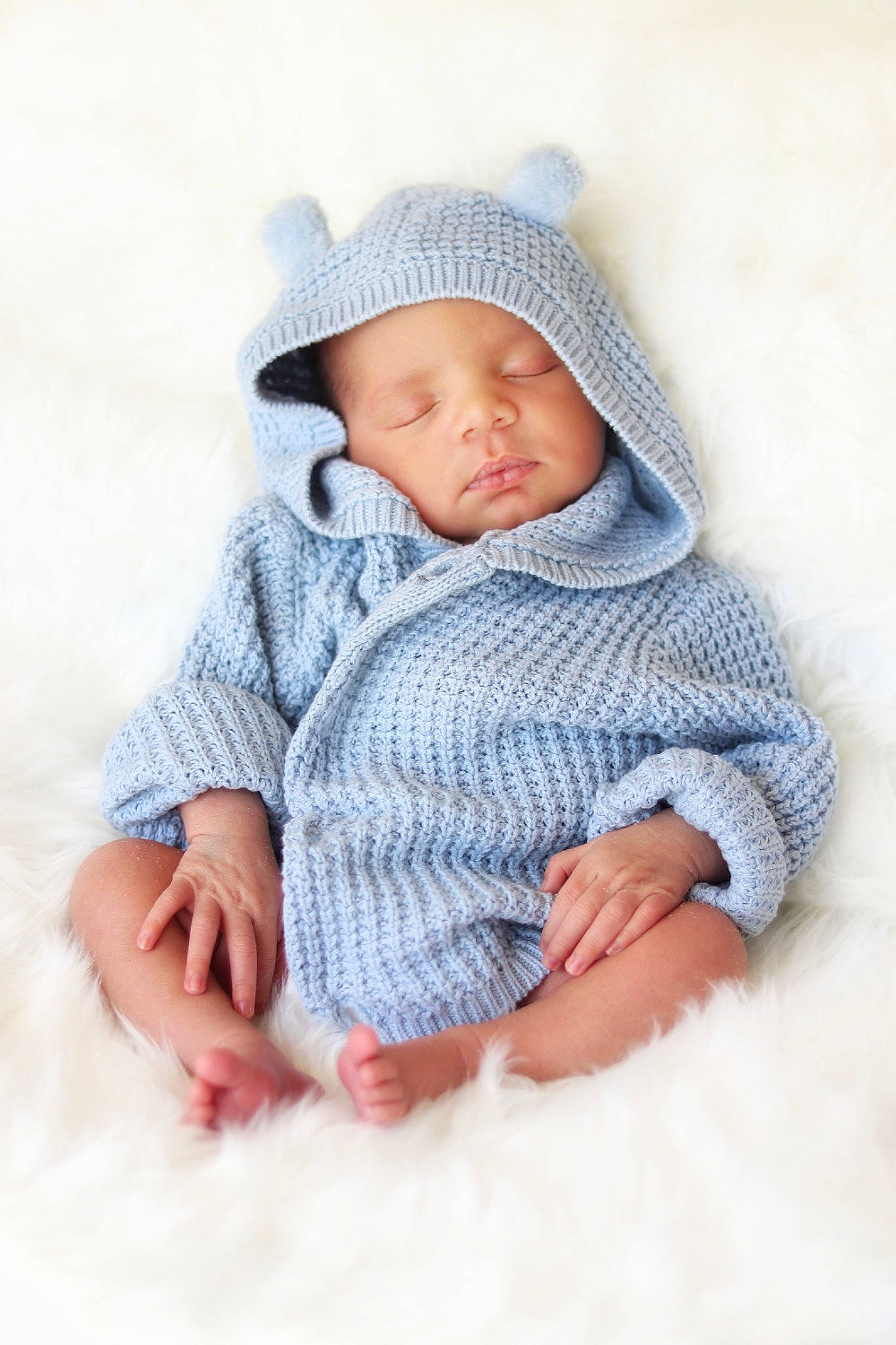 True is registered to the contest to win money with this photo: baby, baby_sleeping, beanie, blue, bonnet, cap, child, headgear, headwear, knit_cap, knitting, outerwear, person, photograph, photography, portrait_photography, skin, sleep, toddler, wool