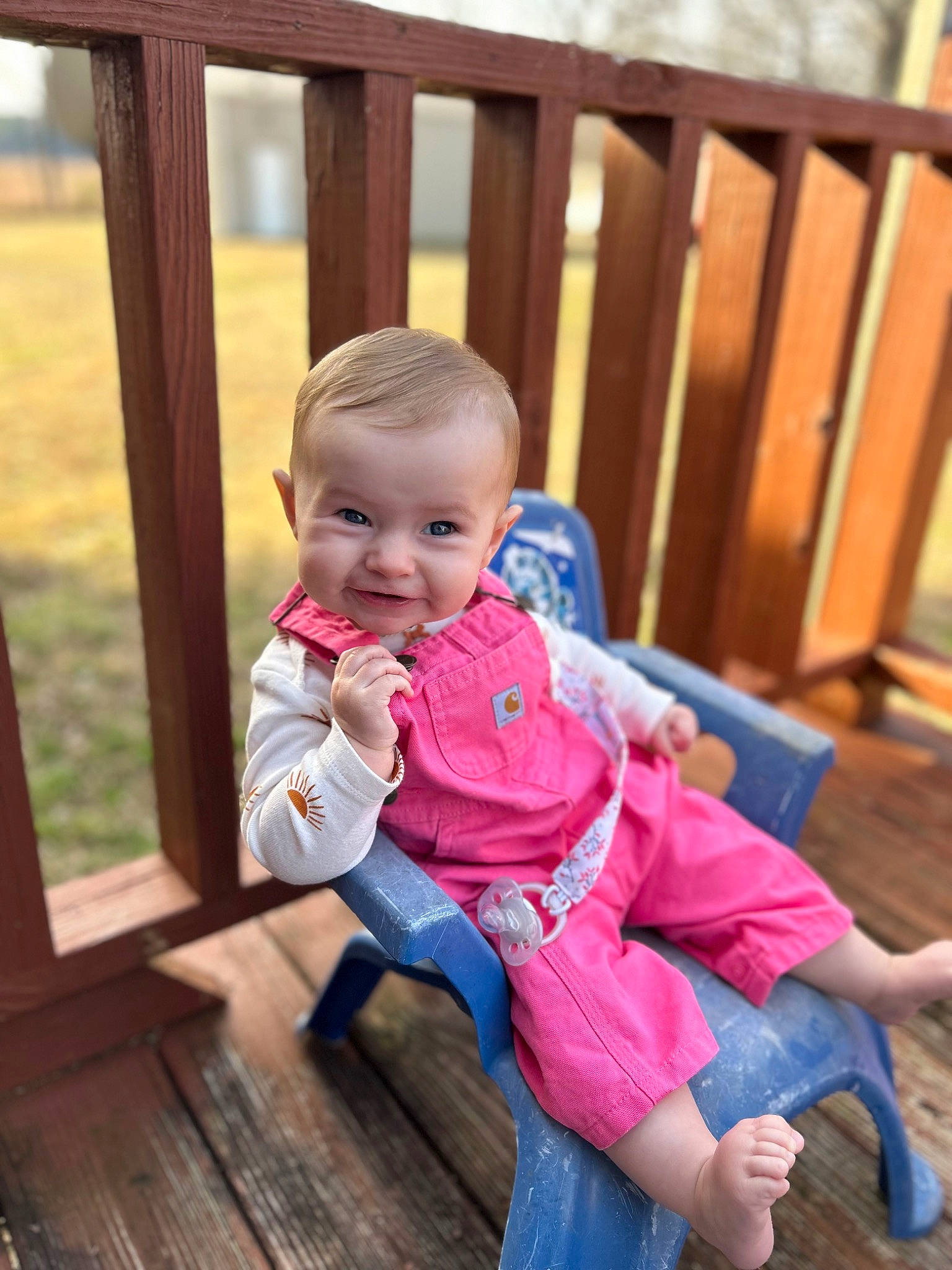 Rubie is registered to the contest to win money with this photo: baby, baby_toddler_clothing, child, deck, flooring, fun, grass, happy, hardwood, home, leisure, person, recreation, sitting, skin, smile, toddler, vacation, wood, wood_flooring