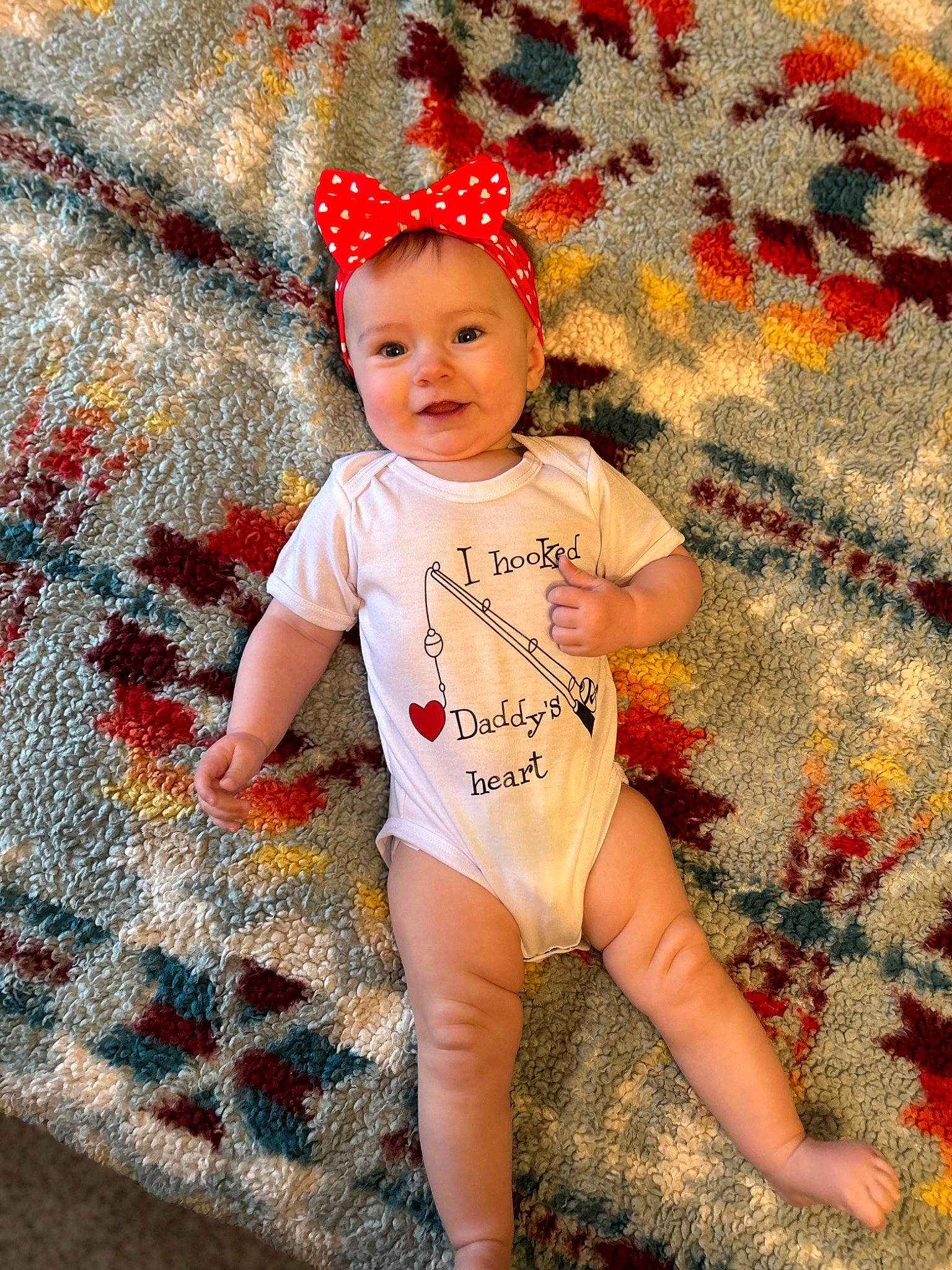 Rubie joined the competition — help win amazing prizes! baby, baby_toddler_clothing, cap, carmine, child, flooring, fun, grass, happy, headwear, human_leg, joy, orange, pattern, people_in_nature, person, red, sleeve, t_shirt, textile