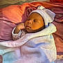 Nyri joined the competition — help win amazing prizes! baby, sleeping, blanket, hat, pink, cushion, newborn, infant, face, peaceful, soft, wrapped, resting, cozy, indoor, child, cute, portrait, headwear, toddler