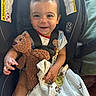 Kyson joined the competition — help win amazing prizes! baby, car_seat, teddy_bear, blanket, pacifier, smile, child, infant, seatbelt, warning_label, clothing, cute, portrait, happy, indoors, person, toy, security, young_child, sitting