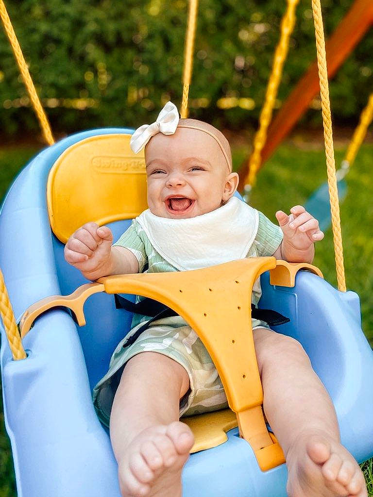 Ila joined the competition — help win amazing prizes! arm, baby, blue, eye, facial_expression, fun, hand, happy, head, headwear, human_body, leg, organ, people_in_nature, person, photograph, product, skin, smile, swing
