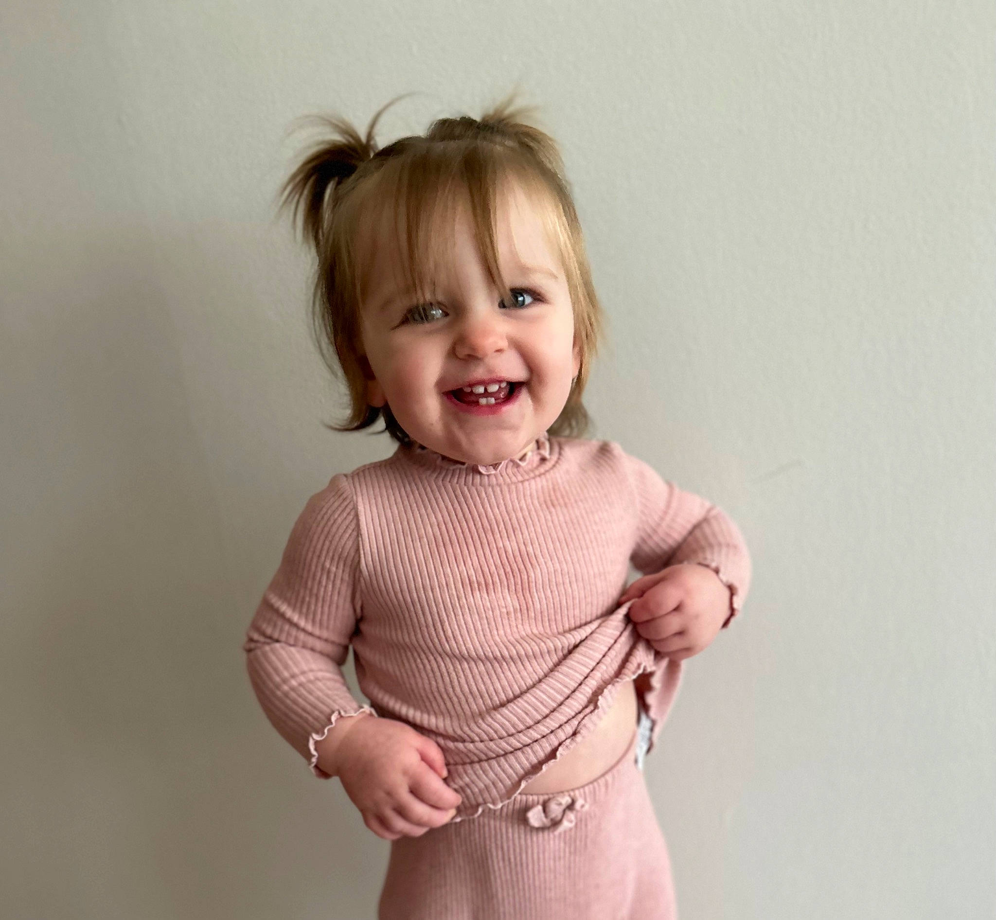 Sylvie is registered to the contest to win money with this photo: baby, baby_toddler_clothing, child, chin, collar, elbow, face, gesture, happy, joy, laugh, magenta, neck, pattern, person, portrait_photography, sleeve, smile, thumb, toddler