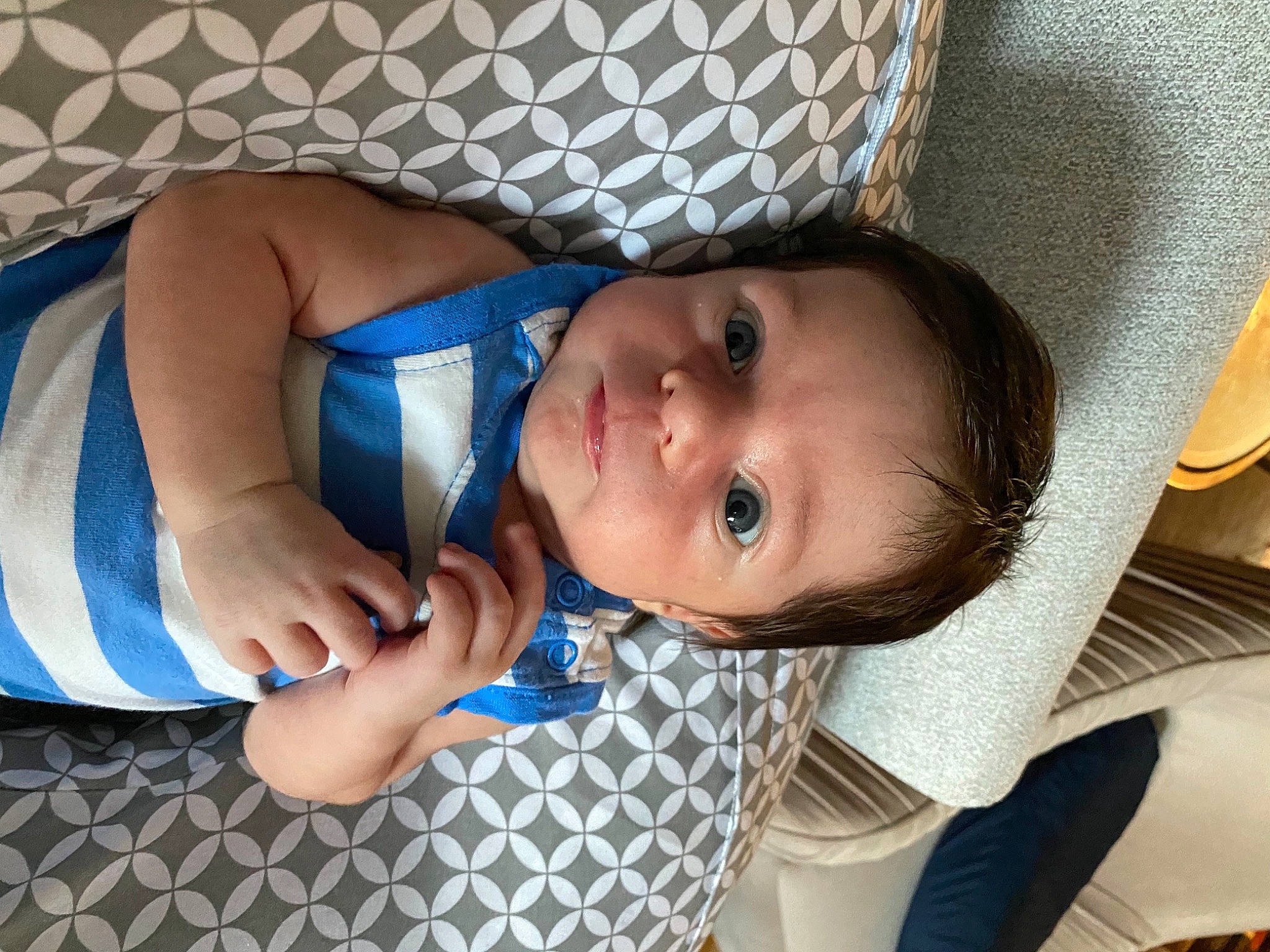 Oliver is registered to the contest to win money with this photo: baby, baby_products, baby_toddler_clothing, cheek, chest, child, comfort, dress, eye, eyelash, finger, hand, hat, iris, lip, mouth, nose, person, skin, smile
