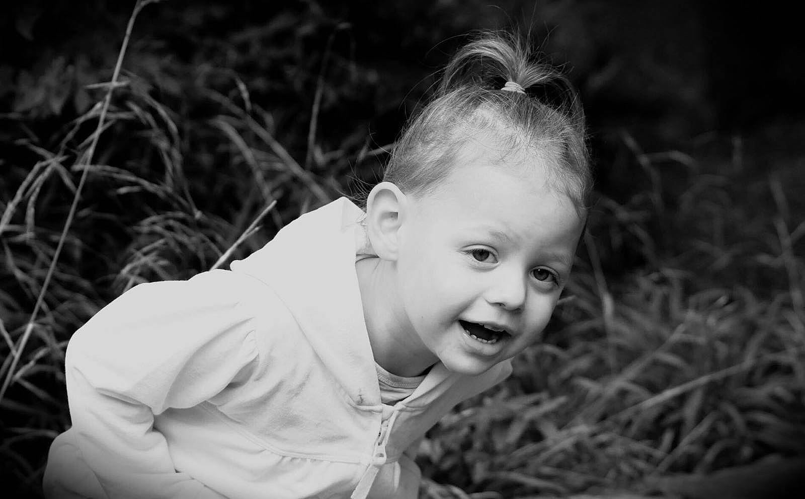 Nicole joined the competition — help win amazing prizes! black, black_and_white, cheek, child, eye, face, facial_expression, flash_photography, grass, head, monochrome, monochrome_photography, people, person, photograph, photography, portrait, portrait_photography, smile, toddler