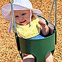 baby, child, swing, playground, hat, bib, sunlight, smile, happy, outdoor, woodchips, green, seat, metal, summer, cute, infant, fun, play, park