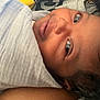 Egyptian is registered to the contest to win money with this photo: baby, infant, face, blanket, wrapped, curly_hair, sleeping, closeup, person, resting, soft, indoors, skin, head, expression, cute, newborn, child, portrait, cozy