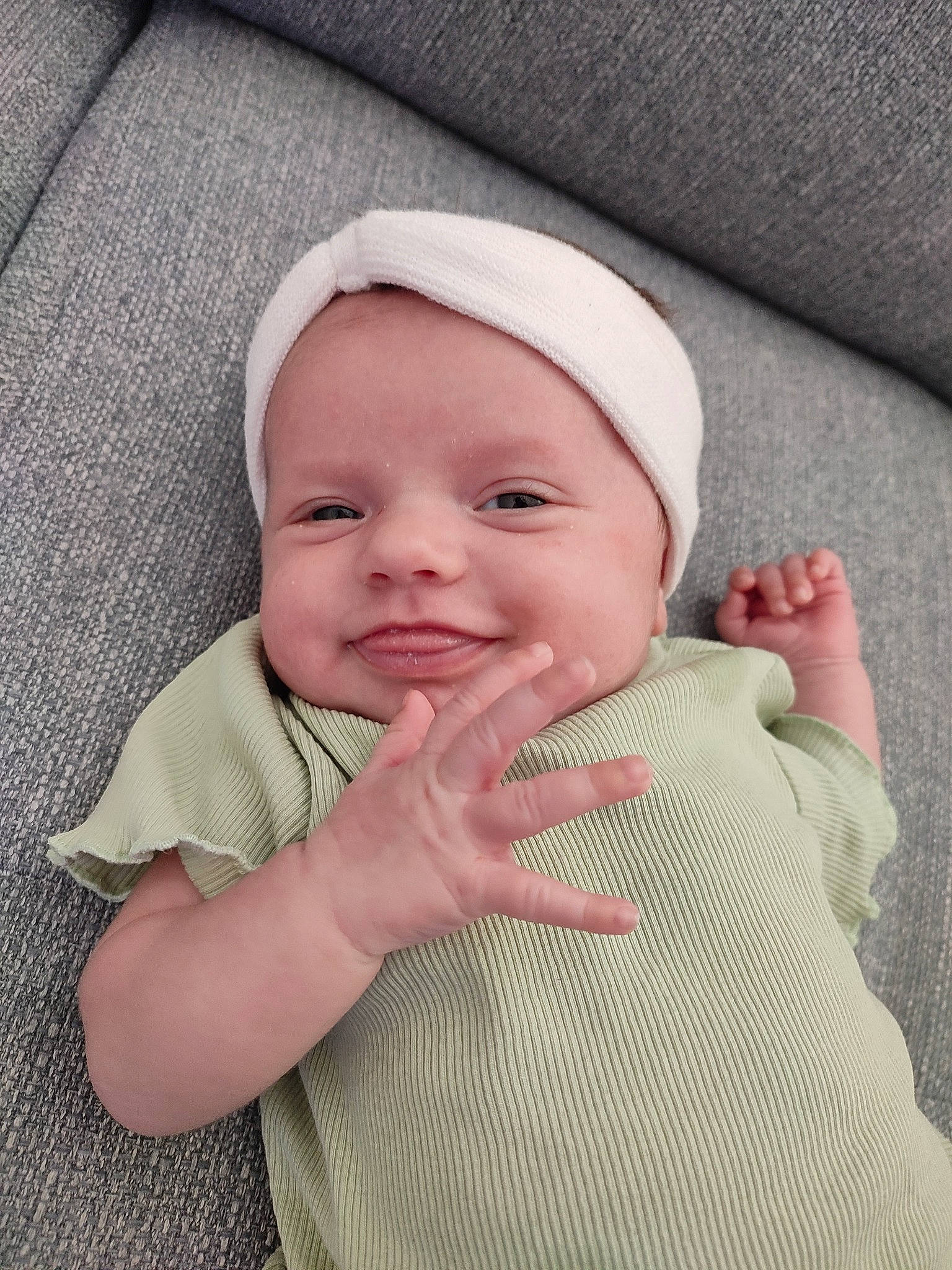 Léna participe au concours pour gagner de l'argent avec cette photo : baby, baby_toddler_clothing, cap, cheek, comfort, eyebrow, face, gesture, happy, headwear, joy, lip, mouth, nose, outerwear, person, pink, skin, sleeve, smile