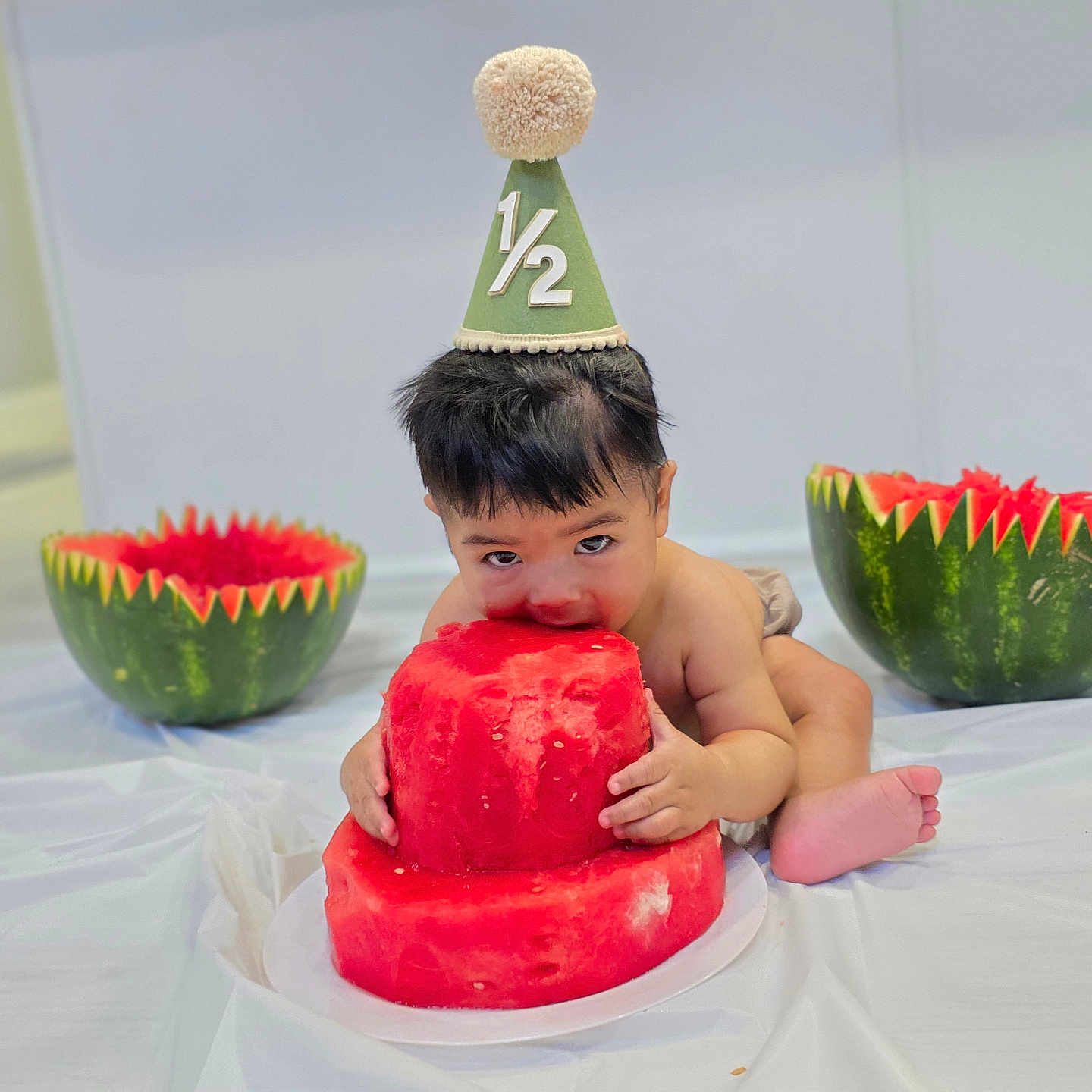 Hezekiah joined the competition — help win amazing prizes! baby, birthdaycake, cake, clothing, cream, dessert, eating, face, food, fruit, hat, head, melon, people, person, photography, plant, portrait, produce, watermelon