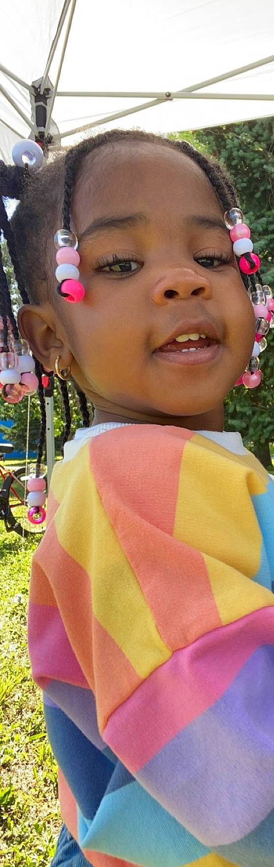 Taylin is registered to the contest to win money with this photo: cheek, chin, eyelash, face, fun, grass, green, happy, iris, lip, mouth, nose, organ, people, person, pink, plant, skin, tire, wheel