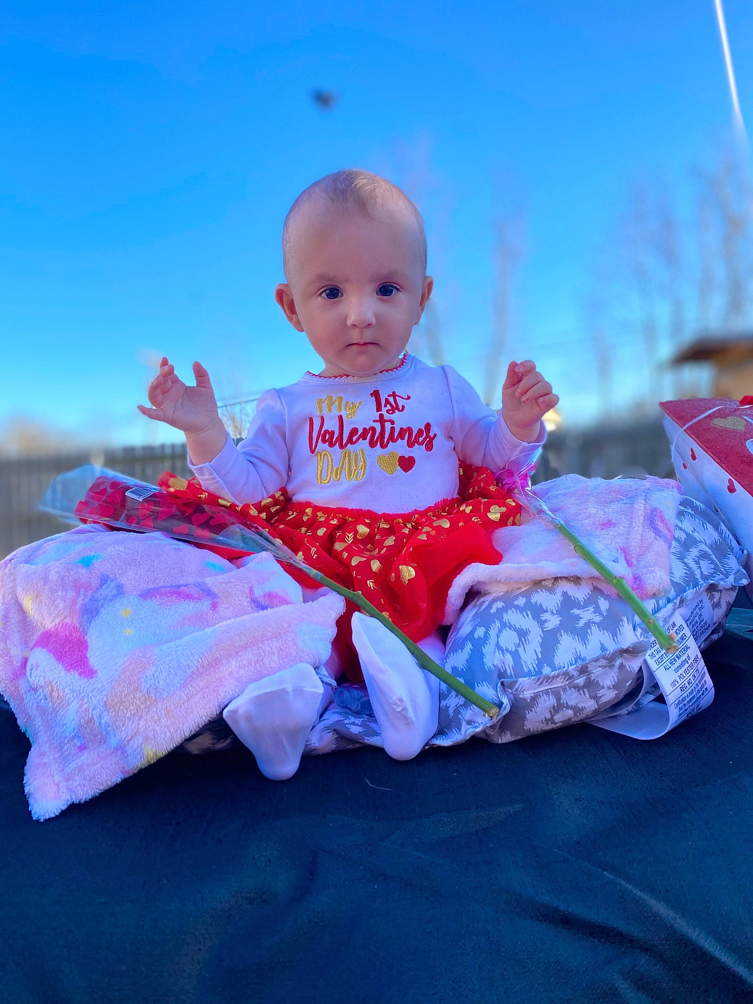 Nimah is registered to the contest to win money with this photo: baby, baby_toddler_clothing, child, electric_blue, eye, flash_photography, fun, grass, happy, leisure, magenta, people_in_nature, person, pink, purple, recreation, sitting, sky, sleeve, t_shirt