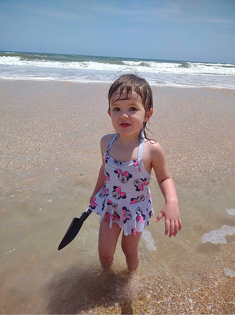 Scarlet joined the competition — help win amazing prizes! barefoot, beach, child, cloud, coastal_and_oceanic_landforms, dress, face, fun, happy, human_body, human_leg, people_in_nature, people_on_beach, person, sand, shore, sky, toddler, waist, water
