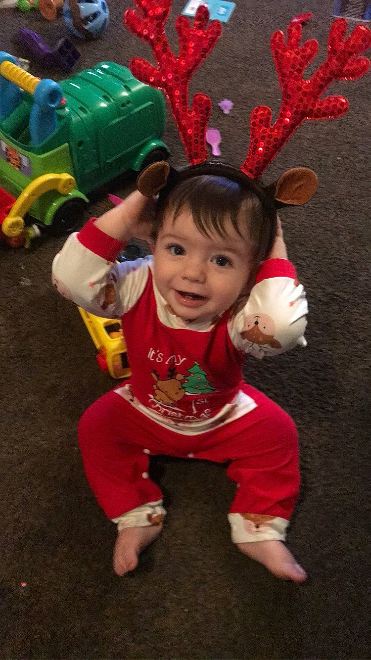 Jet joined the competition — help win amazing prizes! baby_toddler_clothing, child, christmas_ornament, costume, costume_hat, event, eye, fun, green, happy, holiday, holiday_ornament, ornament, party_supply, person, pink, red, sleeve, smile, toddler