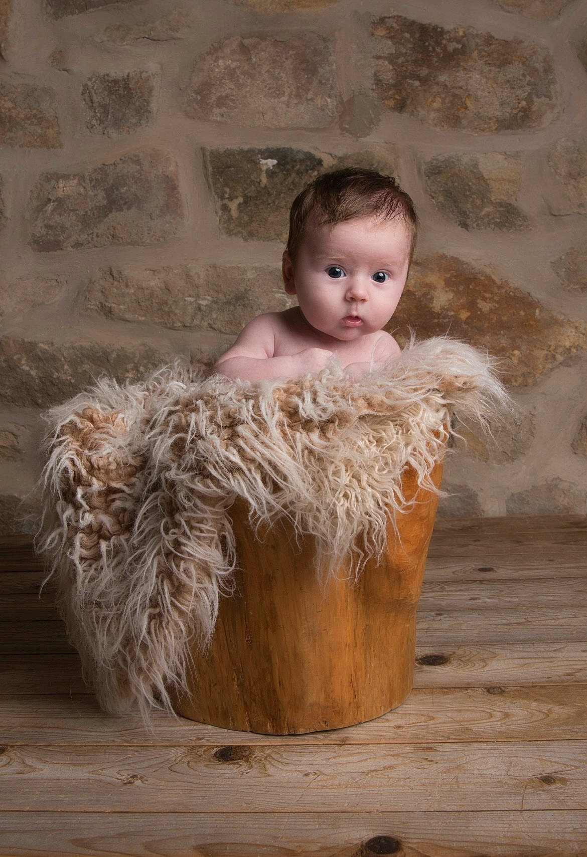 Abel is registered to the contest to win money with this photo: art, baby, baby_toddler_clothing, child, fawn, flash_photography, fur, hardwood, natural_material, peach, person, sitting, surprise, toddler, visual_arts, wood