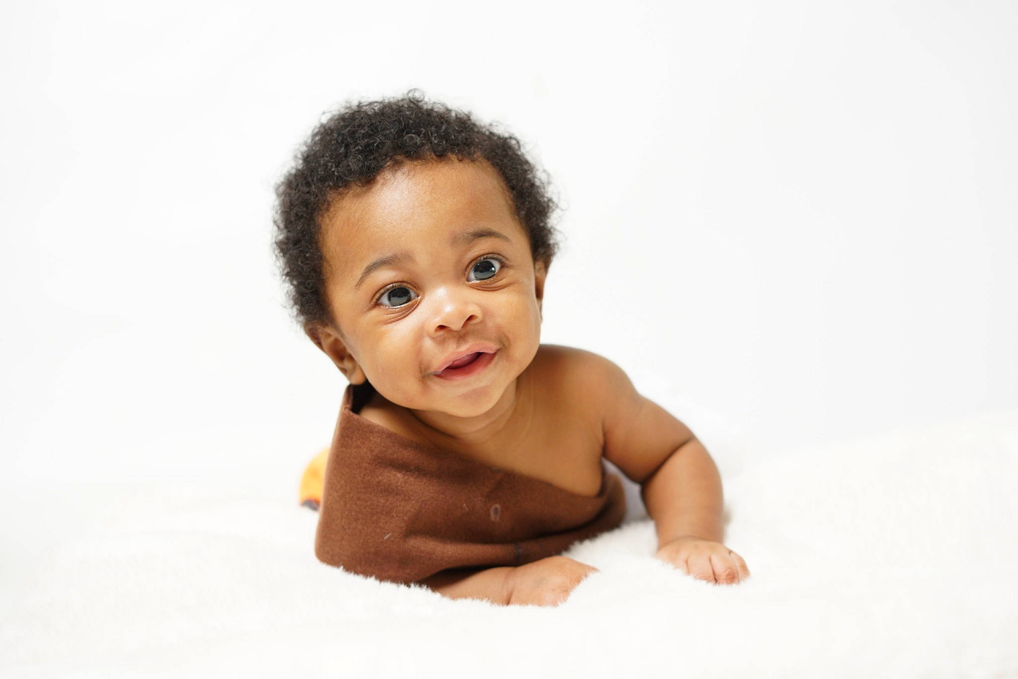 Malachi Evans is registered to the contest to win money with this photo: baby, baby_crawling, baby_toddler_clothing, bathing, cheek, chest, child, collar, elbow, eyelash, flash_photography, flooring, gesture, happy, person, portrait_photography, sitting, sleeve, smile, t_shirt