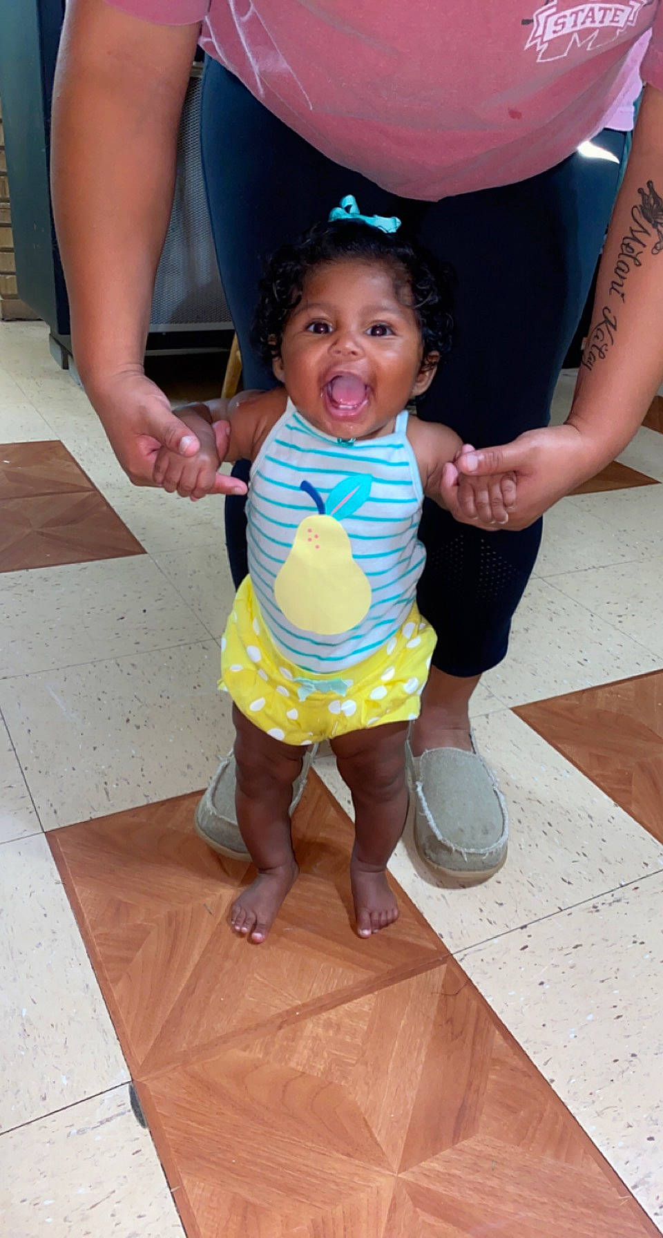 Melani joined the competition — help win amazing prizes! baby, baby_toddler_clothing, facial_expression, finger, floor, flooring, fun, gesture, hairstyle, happy, hat, joint, leg, leisure, person, pink, sandal, skin, thigh, toddler