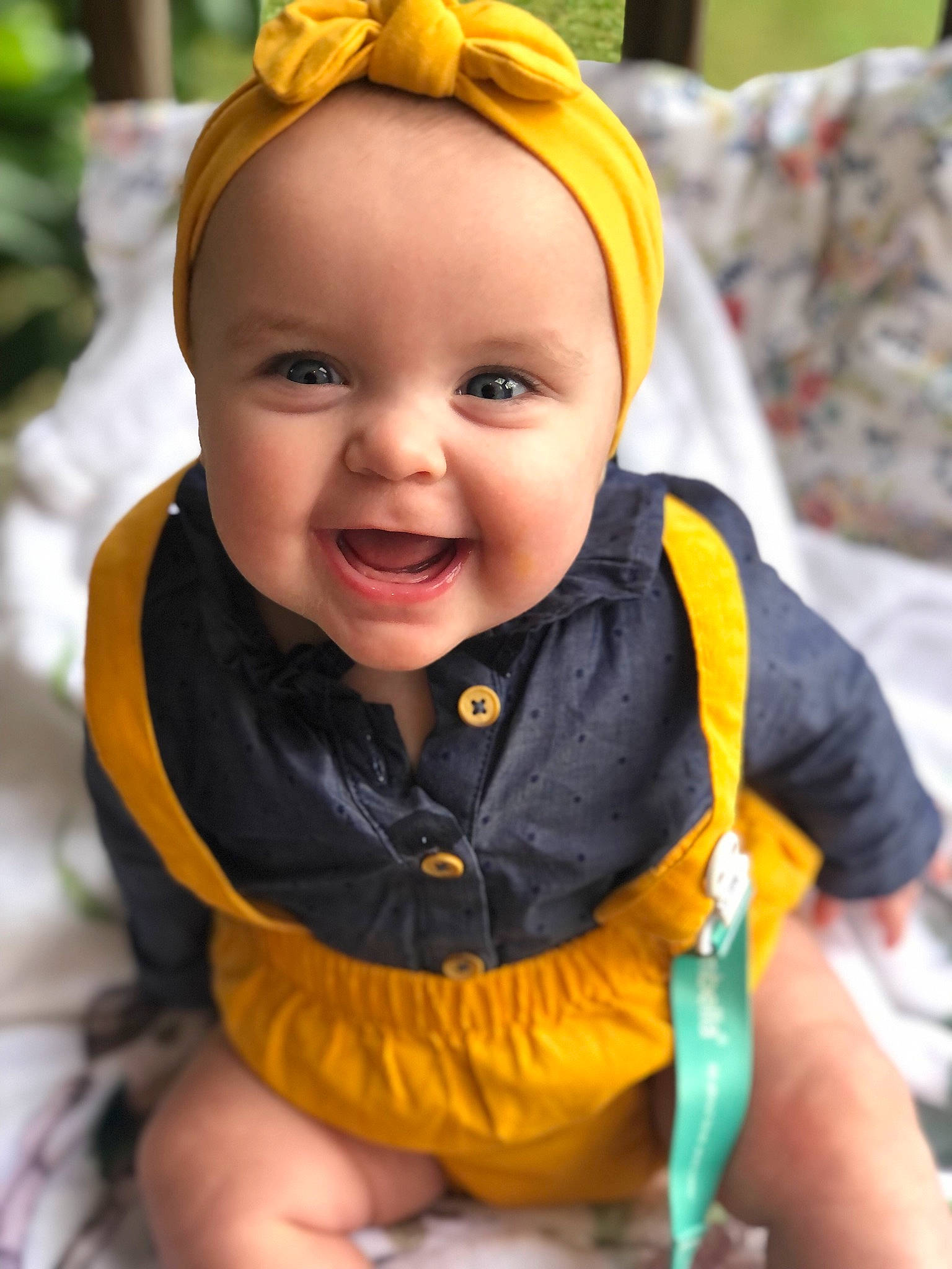 Raylee is registered to the contest to win money with this photo: baby, baby_toddler_clothing, cheek, child, chin, eye, fun, grass, happy, head, human_body, iris, leisure, lip, orange, person, plant, skin, smile, toddler