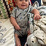 Kazdyn joined the competition — help win amazing prizes! baby, smiling, infant, plush_toy, blanket, crochet, couch, comfortable, happy, cute, clothing, bracelet, indoor, cozy, child, portrait, sitting, soft, toy, home