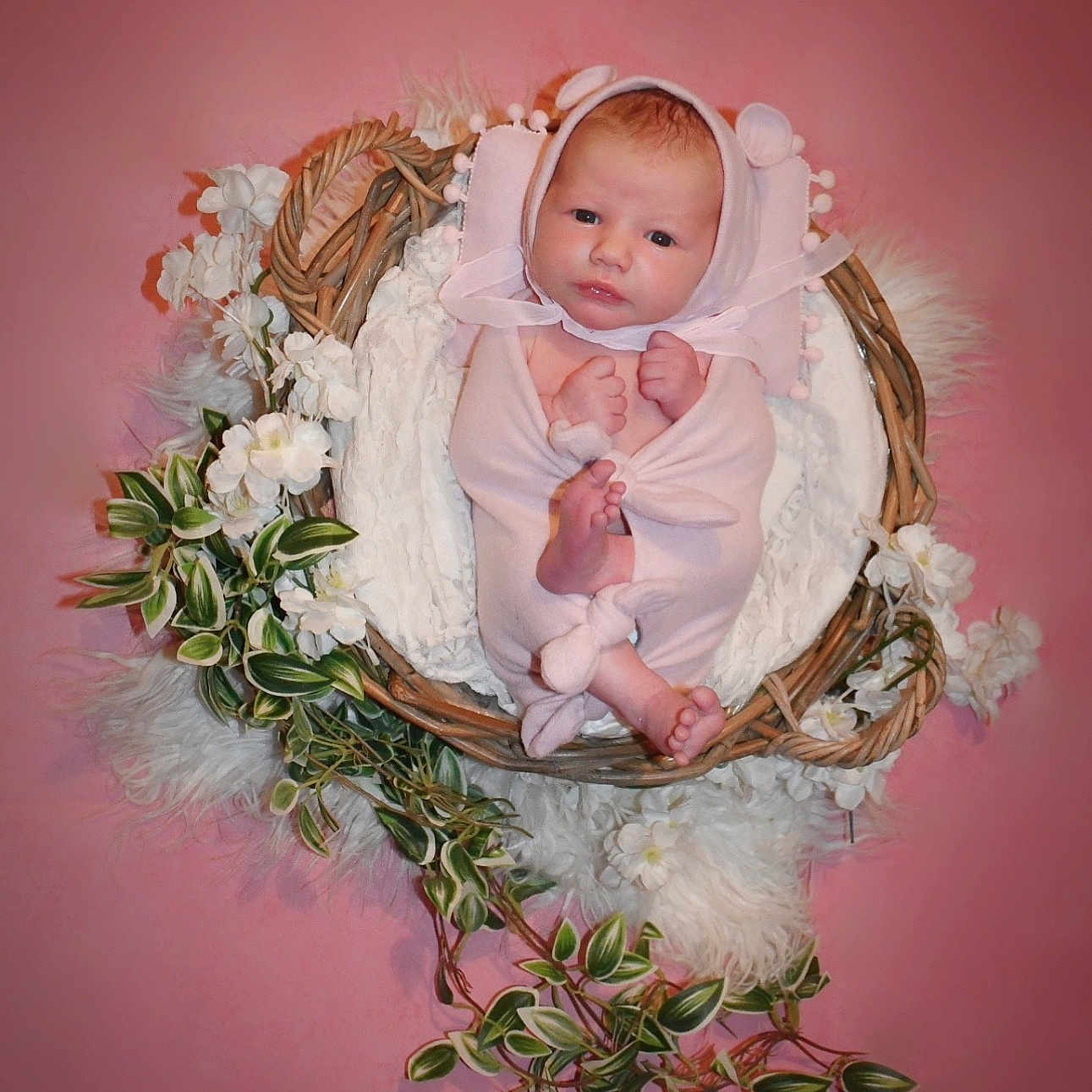 Alba participe au concours pour gagner de l'argent avec cette photo : baby, basket, bed, bonnet, cap, clothing, dress, face, flower, flowerarrangement, flowerbouquet, furniture, hat, head, newborn, pattern, person, photography, plant, portrait